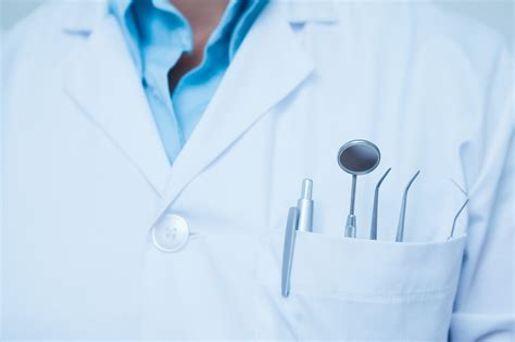 ‘Perv’ dentist was obsessed with patient’s fake boobs: suit.